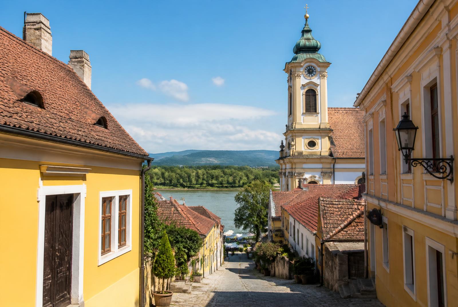 Pastel houses and cobbled lane sloping to the Danube in Szentendre, Hungary