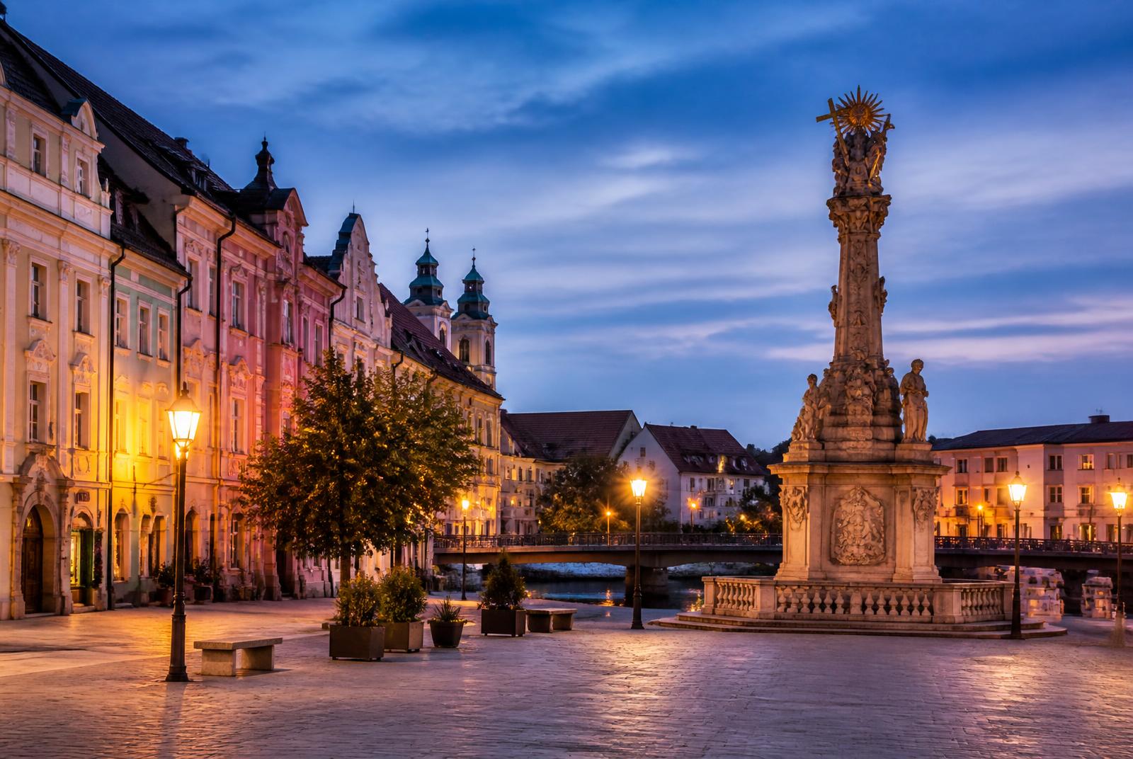 Baroque old town square at dusk with column monument in Győr, Hungary